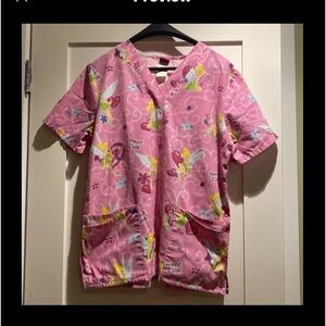 One Tinkerbell scrub. Size medium